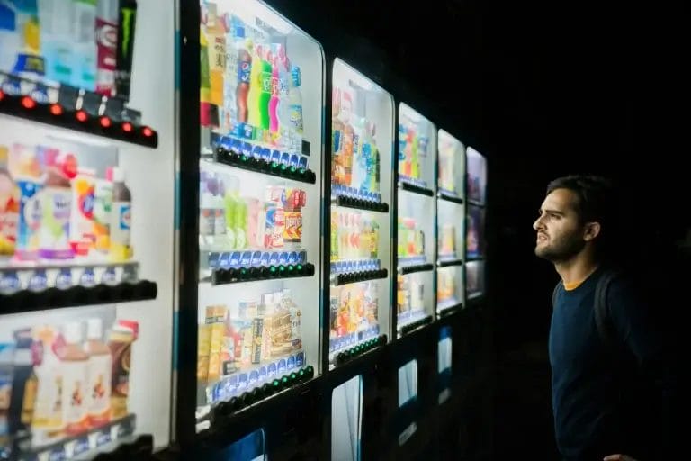 Person facing a wall of options, illustrating decision fatigue and choice overload